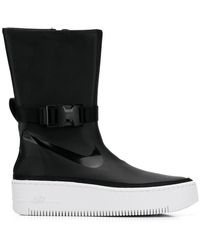Women's Nike Flat boots from $116 | Lyst