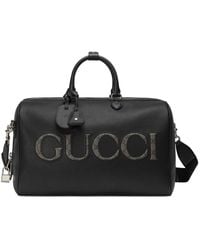 Gucci - Logo-embossed Leather Duffle Bag - Lyst