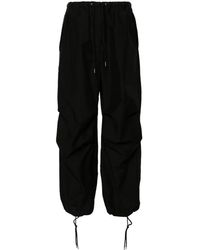 Acne Studios - Pantalones anchos con logo bordado - Lyst
