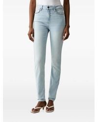 Guess - Crystal-Embellished Logo-Patch Jeans - Lyst