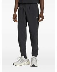 adidas - Pantalones De Chándal Tech Trefoil Essentials - Lyst