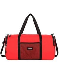 Eastpak - X Telfar Large Duffel Logo Patch Duffle Bag - Lyst