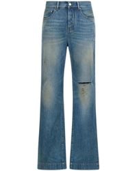 Amiri - Slash Flared Distressed Jeans - Lyst