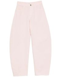 Alaïa - Alaia Curved-Leg Jeans - Lyst