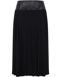 Alaïa - Alaia Belt Midi Skirt - Lyst