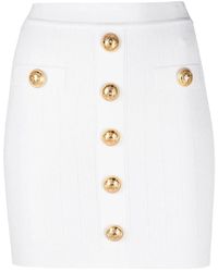 Balmain - Chic Button-Detail Knitted Miniskirt - Lyst