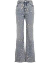 McQueen - Midwash Distressed Flared Jeans - Lyst