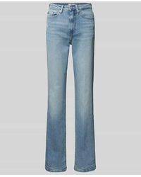 Tommy Hilfiger - Bootcut Fit Jeans im Destroyed-Look - Lyst