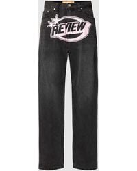 Review - Baggy Jeans Met Gewatteerde Logoprint - Lyst