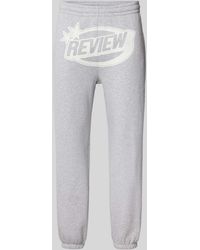 Review - Regular Fit Sweatpants mit Label-Print - Lyst