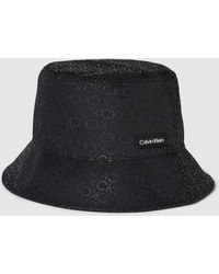 Calvin Klein - Bucket Hat mit Allover-Label-Print Modell 'MONOGRAM' - Lyst
