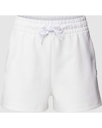 Lacoste - Shorts mit Gesäßtasche - Lyst