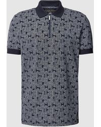 Christian Berg Men - Regular Fit Poloshirt mit Allover-Label-Print - Lyst