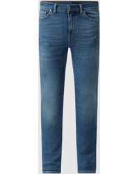Model evolve in het Blauw voor heren Heren Kleding voor voor Jeans voor Slim jeans Tiger Of Sweden Denim Slim Fit Jeans Met Stretch 