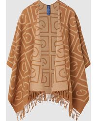Bazar Deluxe Wolle Wolle poncho in Braun Damen Bekleidung Pullover und Strickwaren Ponchos und Ponchokleider 