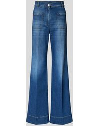Victoria Beckham - Flared Jeans mit Label-Stitching - Lyst