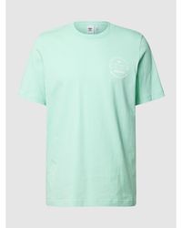 adidas Originals T-Shirt mit Label-Print - Grün