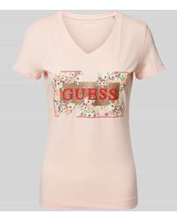 Guess - T-Shirt mit floralem Muster und Label-Print - Lyst