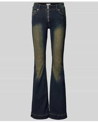Weekday - Flared Jeans im Used-Look mit Reißverschluss Modell 'Inferno' - Lyst