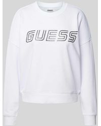 Guess - Sweatshirt mit überschnittenen Schultern und Label-Print - Lyst