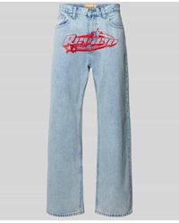 Review - Baggy Fit Jeans mit Label-Print - Lyst