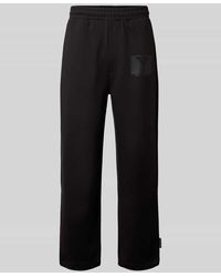 carlo colucci - Wide Fit Sweatpants mit Logo-Print - Lyst
