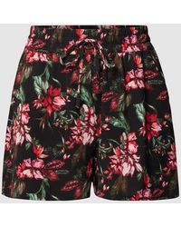 Only Carmakoma - PLUS SIZE Shorts mit floralem Muster - Lyst