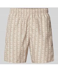 Lacoste - Regular Fit Shorts mit Allover-Label-Muster - Lyst