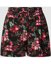 Only Carmakoma - PLUS SIZE Shorts mit floralem Muster - Lyst
