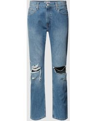 Tommy Hilfiger - Relaxed Straight Fit Jeans mit Destroyed-Effekten Modell 'Ethan' - Lyst