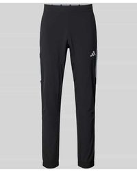 adidas - Slim Fit Trainingshose mit Logo-Print Modell 'Tech' - Lyst