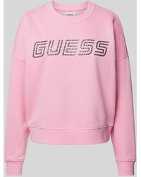 Guess - Sweatshirt mit überschnittenen Schultern und Label-Print - Lyst