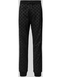 Karl Lagerfeld - Regular Fit Sweatpants mit Allover-Label-Print - Lyst