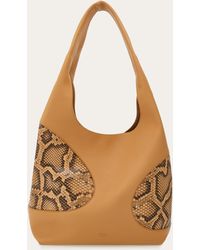 Ferragamo - Hobo bag with cut-out detailing - Lyst