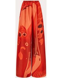 Ferragamo - Fish Print Silk Palazzo Trousers - Lyst
