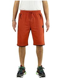 Pantalones cortos de color Naranja de hombre: hasta el 63 % de descuento |  Lyst