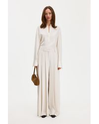 Filippa K - Fully Pleated Trousers - Lyst