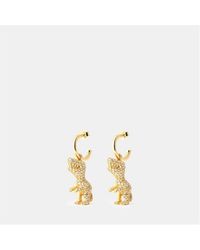 COACH - Junior Rexy Hug Huggie Earrings - Lyst