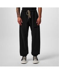 Fear Of God - Tapered Logo-appliquéd Cotton-blend Jersey Sweatpants - Lyst