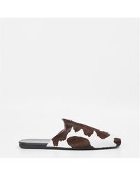 Prada - Flat Mules - Lyst