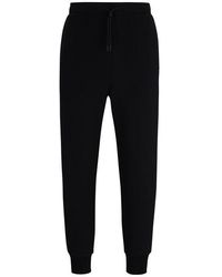 BOSS - Hadiko Curved joggers - Lyst