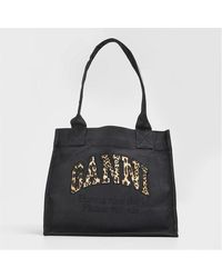 Ganni - Embossed Logo Tote Bag - Lyst
