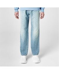 Balmain - Monogrammed Jacquard Denim Jeans - Lyst