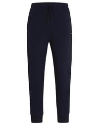 BOSS - Hadiko Curved joggers - Lyst