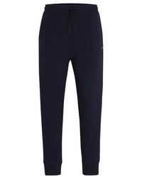 BOSS - Hadiko Curved joggers - Lyst