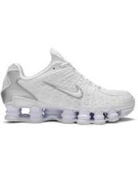white nike shocks shoes