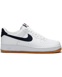 white and black air forces with gum bottoms