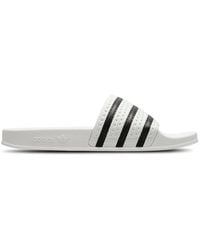 adidas - Adilette Flip-Flops And Sandals - Lyst