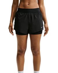 Nike - Swift Dri-Fit Mid-Rise 2-In-1 Shorts Shorts - Lyst