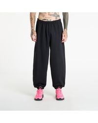 Nike - Broeken Solo Swoosh Cuffed Fleece Pants - Lyst